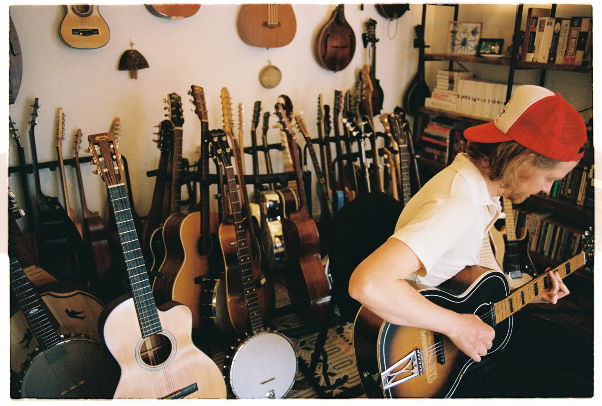 Adam surrounded by instruments in his collection