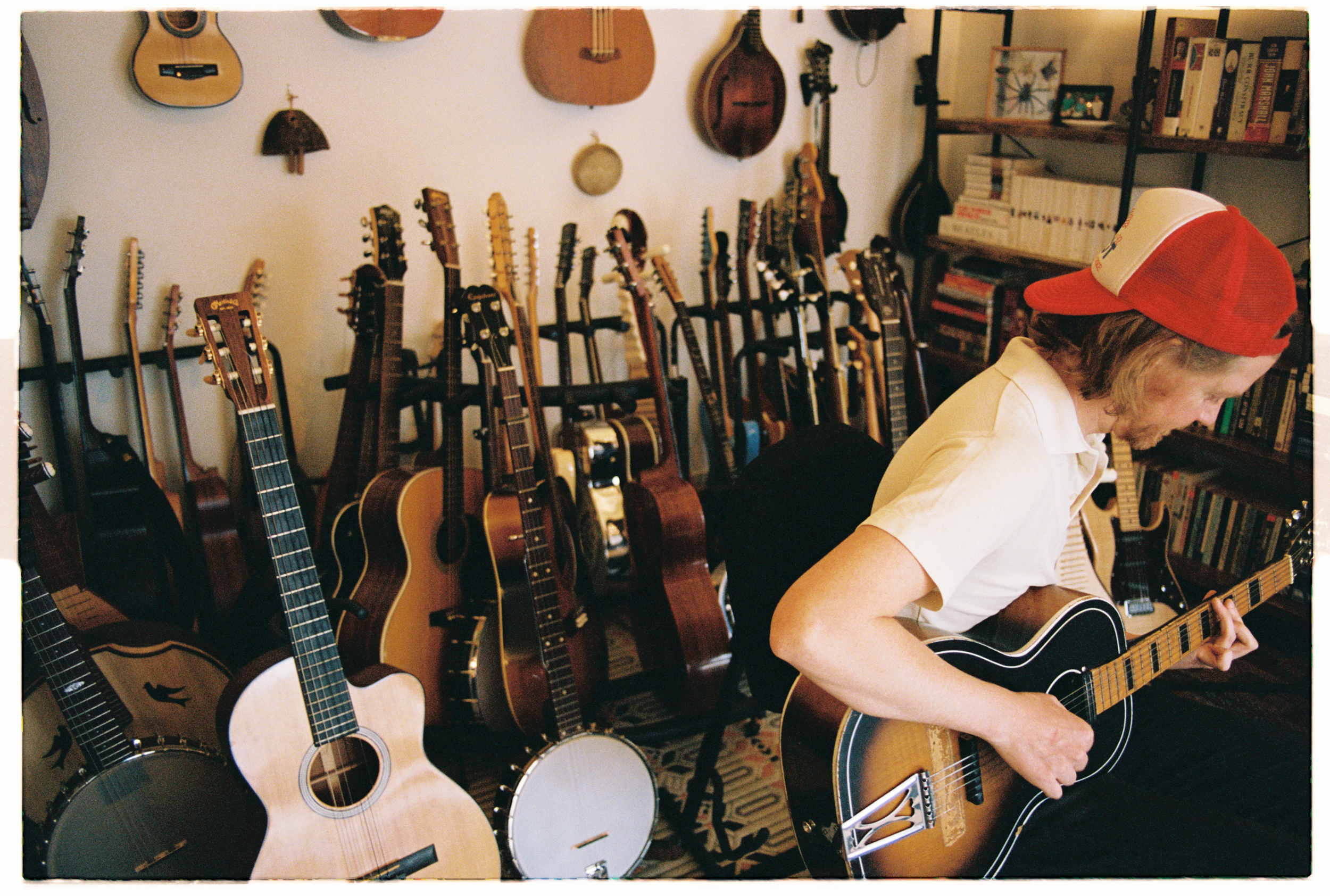 Adam surrounded by instruments in his collection